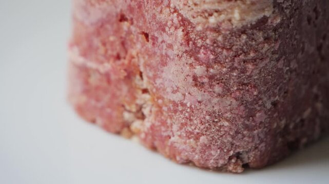 Close-up texture of canned stewed meat. Detailed food background, suitable for camping, survival, or culinary concepts. High quality 4k footage