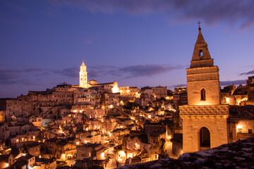 Fototapeta premium Matera in the blue hour,&nbsp;when the Sassi glow softly beneath a deepening southern sky.