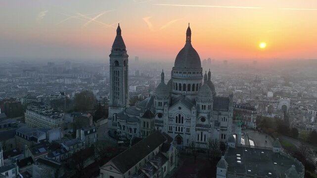 aerial view of Sacre Coeur basilica in Montmartre, Paris, drone sunrise shot of the basilica of the Sacred Heart in the capital of France, Paris