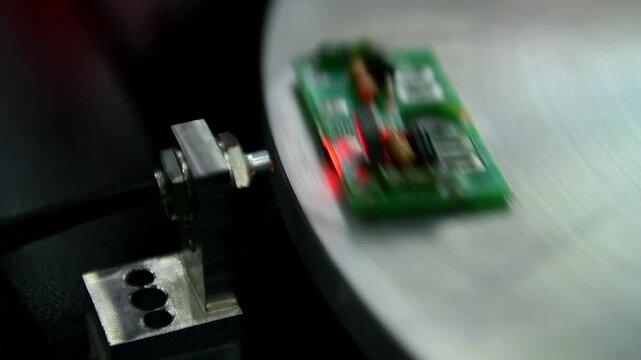 Close-up of Automatic system for inspection for checking the quality of electronic PCB circuit boards selective focus in Manufacturing