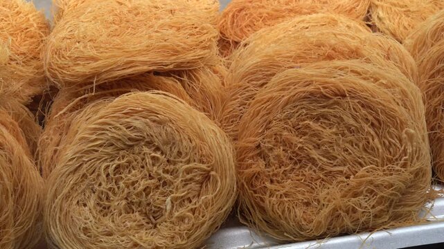 Raw kataifi dough nests for traditional middle eastern dessert