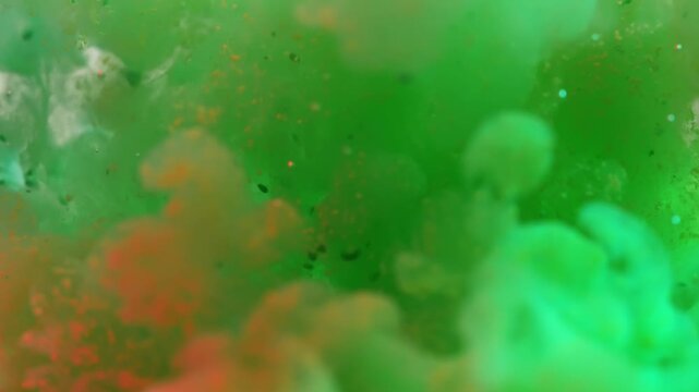 Green and yellow paint cloud spreading in water on a white background. Premium marketing concept for overlay effects, creative branding, banner and advertising layout design, ecology, beauty, and
