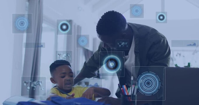 Animation of data processing over african american father helping his son with homework at home