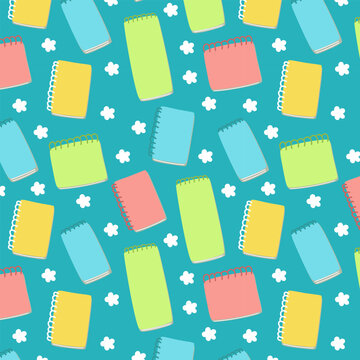 Creative seamless pattern of colorful notepads and flower motifs on a bright blue background. Vibrant cheerful design for school supplies, digital backdrops and textile print.
