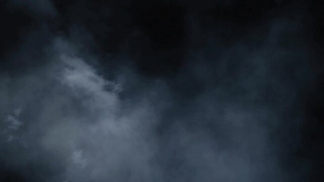 Darkness with smoke or fog rising.