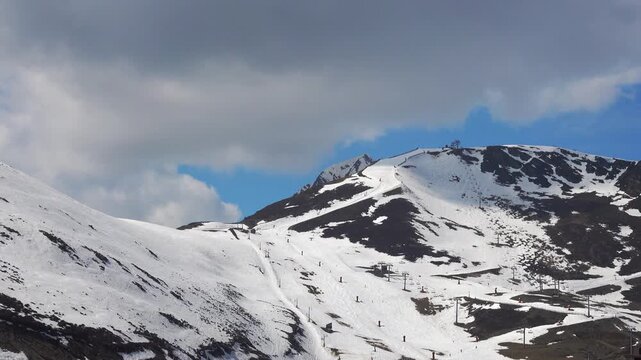 People skiing and enjoying the snowy slopes