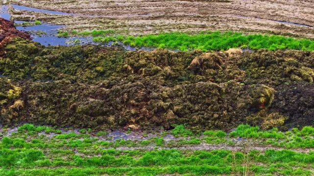 Aerial view of organic compost manure piles in an agricultural fields