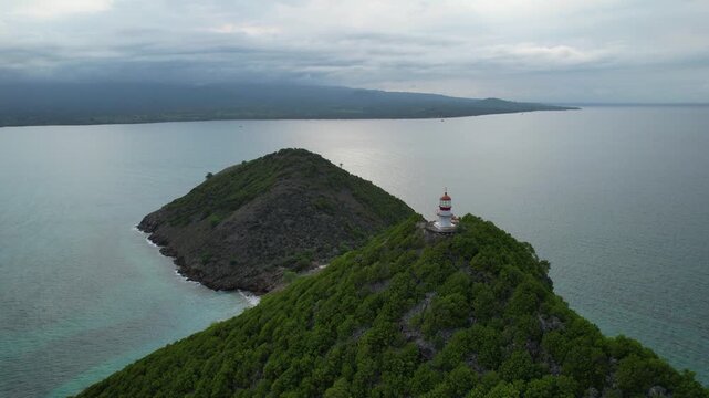 Static drone shot of bids and the Lighthouse on Ilh&eacute;u das Cabras Islet, Sao Tome