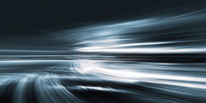 Streaking light trails create a sense of rapid motion.