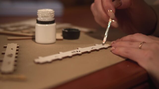 Painting Wooden Strips With Primer Carefully. Brushing White Primer Onto Wooden Parts For Preparation. Media