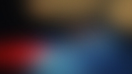 Obraz premium Grainy blurred gradient background with deep black and soft red blue and golden yellow light patches blending into a dark atmospheric texture