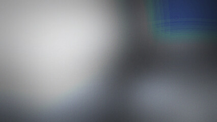 Obraz premium Grainy dark background with a soft white light glow and a subtle blue teal corner accent featuring a smooth blurred gradient texture effect