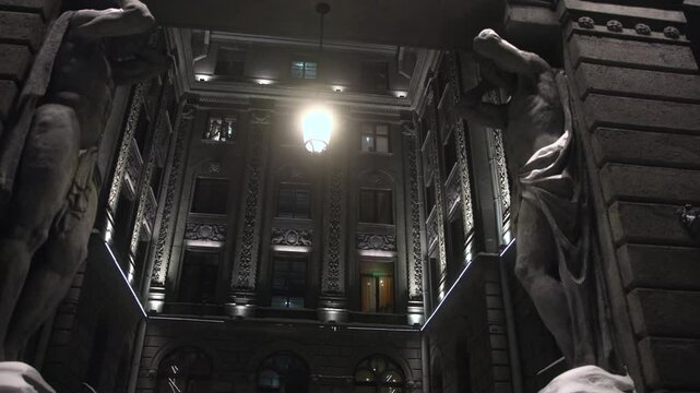 Decorative Foyer With Statues And Lighting. Luxurious Lobby Featuring Statues And Classical Columns. Media