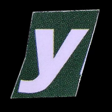 Green letter Z and number one on black background with knitted pattern and colorful blocks design