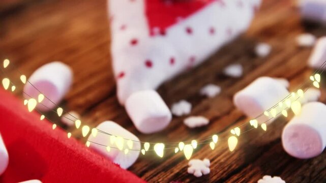 Animation of string lights, marshmallows and xmas decorations