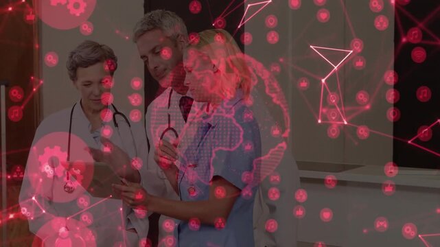 Nurse tapping tablet presenting medical data showing red icons as physicians confirming consensus