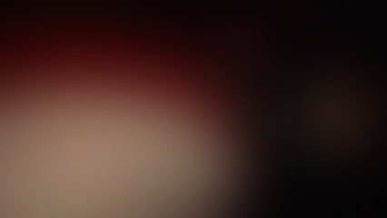 Fototapeta premium Dark abstract background with a soft grainy texture featuring a subtle gradient transition from deep black to muted reddish brown tones