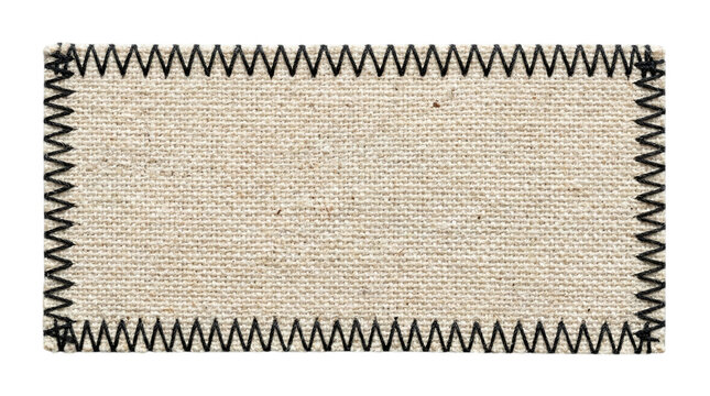 Blank rectangular linen fabric tag with black zigzag stitching around the edges on a transparent background