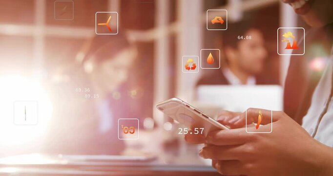 Mid-career woman tapping smartphone in office, producing floating energy icons and numeric data