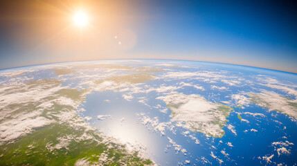 Obraz premium Aerial view of the Earth from space, showcasing land, water, clouds, and sunlight illuminating the atmosphere.