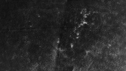 Fototapeta premium Dark graphite texture with layered distressed patterns and gritty abstract depth, creating a moody grunge background