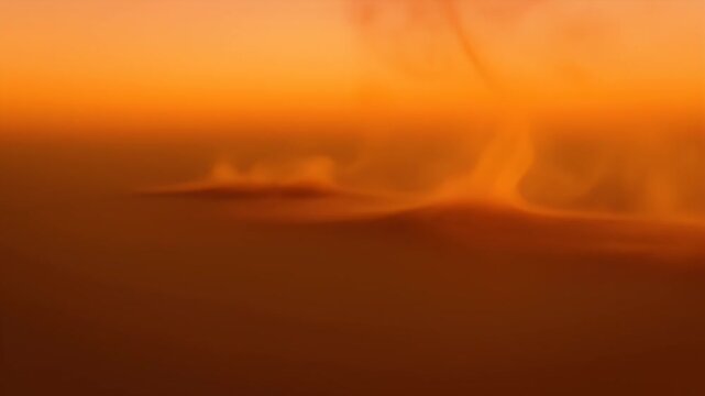 Warm Orange Gradient Background - A smooth, warm orange gradient creates a calming and inviting background. The blurred forms and colors evoke a sense of peace and tranquility.