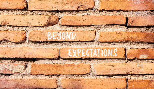 Beyond expectations words symbol. Concept words Beyond expectations on beautiful brick wall. Beautiful brick wall background. Business and Beyond expectations words concept. Copy space.