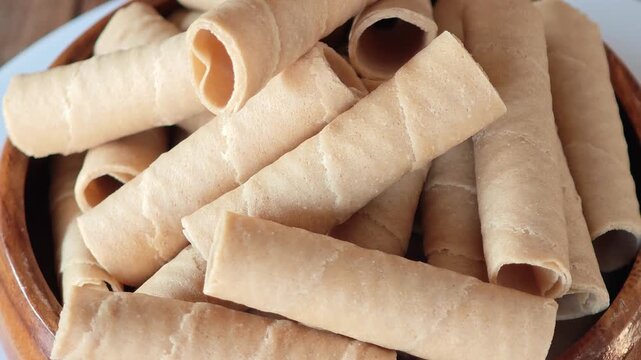 Golden rolled wafer cookies (a snack)