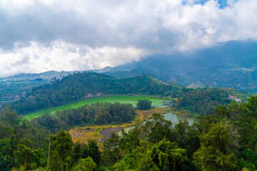 Obraz premium Telaga Warna (Telaga Warna Lake) and Telaga Pengilon (Pengilon Lake) at Dieng Plateau, Central Java. Indonesia, Aerial View from Batu Pandang Ratapan Angin Hill