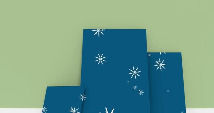 Snowflakes icons falling over three blue frames against copy space on grey background