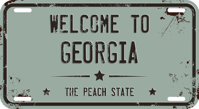 Welcome To Georgia message on rusty license plate