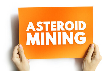Fototapeta premium ASTEROID MINING text on card held by hands, concept of space resource extraction and cosmic exploration technology