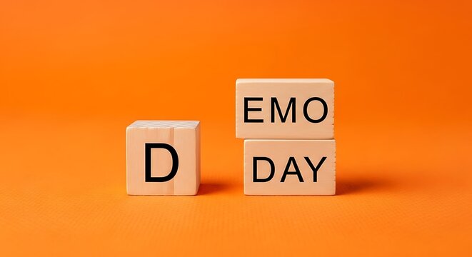 Demo Day business concept on wooden blocks, product demonstration and startup pitch event, wooden cubes with text on orange background