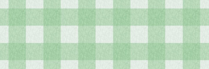 Fototapeta premium Seamless green gingham pattern background with linen fabric texture. Classic checkered plaid design for spring, picnic, kitchen textiles, and rustic cottagecore aesthetic.