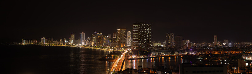 Fototapeta premium Night Aerial Panoramic View Nha Trang Vietnam Sea Bridge City Lights