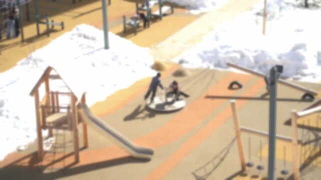 Happy children frolic and ride the merry-go-round in the spring. Children are playing on the playground. Children ride in the yard on a merry-go-round. High quality FullHD footage