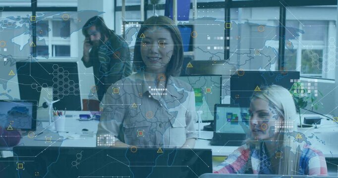 Animation of data processing and world map over two diverse female colleagues discussing at office
