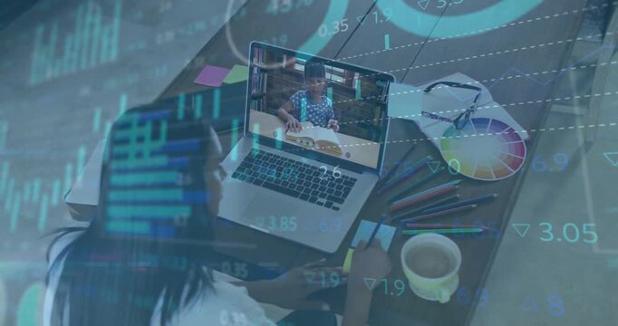 teacher launching finance tutorial at home desk, overlaying finance charts guiding child reading