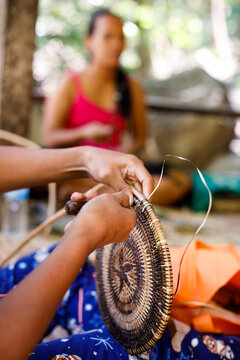 Hands of Indigenous Mangyan Woman Carefully Weaving a Traditional Basket from Bamboo Fibers in Mangyan Village, Talipanan, Puerto Galera, Oriental Mindoro, Philippines