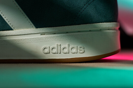 Tyumen, Russia-March 20, 2026: adidas grand court alpha 0 shoes with colorful light display and bold branding