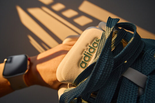 Tyumen, Russia-March 20, 2026: Adidas grand court alpha 0 sneakers in soft light. A watch is on the wrist