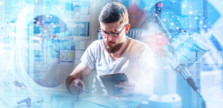 Electronics engineering, Research lab. Technician with tablet tests electronic components amid robotic equipment, analyzing circuits, prototyping devices and validating performance.