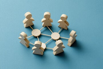 Obraz premium Networked: Wooden figures interconnected, symbolizing a network of collaboration, unity, and shared connections.