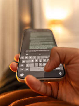 Man hands chatting and typing on smartphone macro closeup. Unrecognizable human typing text message tapping touchscreen keyboard using whatsapp application a social media