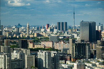 Fototapeta premium Moscow city skyline with Ostankino Tower dominating the urban landscape under sky