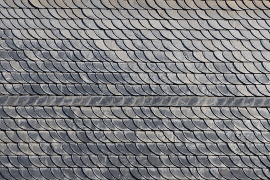 background of slate shingles in grey at a wall