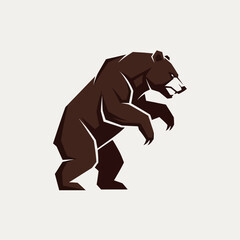 Obraz premium Powerful Brown Bear Standing on Hind Legs in a Striking Pose.