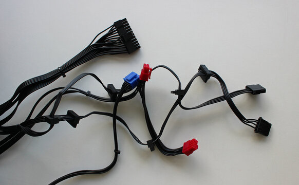 Bunch Of Computer Supply Cables With Colorful Connectors For Parts Installing. Computer Power Supply Cables Isolated On White

