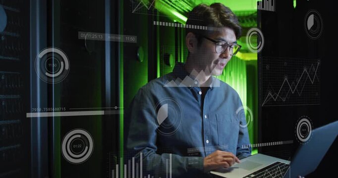 Vertical video: Typing after HUD alert, Korean tech blue shirt checking in server aisle with laptop