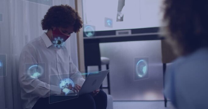 Seated man typing laptop, initiating holographic UI, HUDs circling face while testing AR dashboard